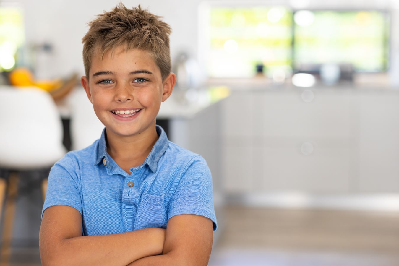 Young boy with his arms crosses