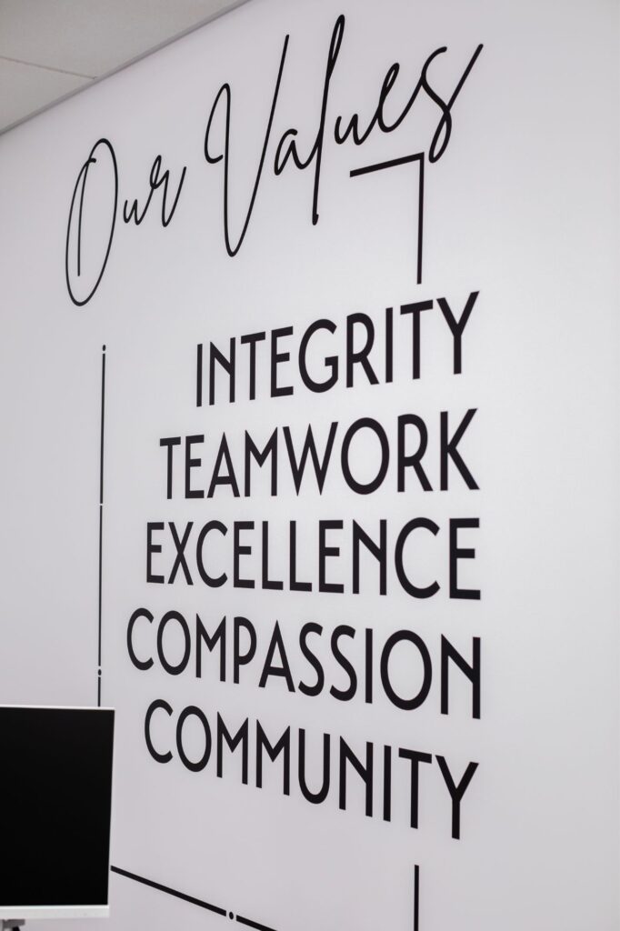 Artemis Smiles Orthodontics values wall: integrity, teamwork, excellence, compassion, community.